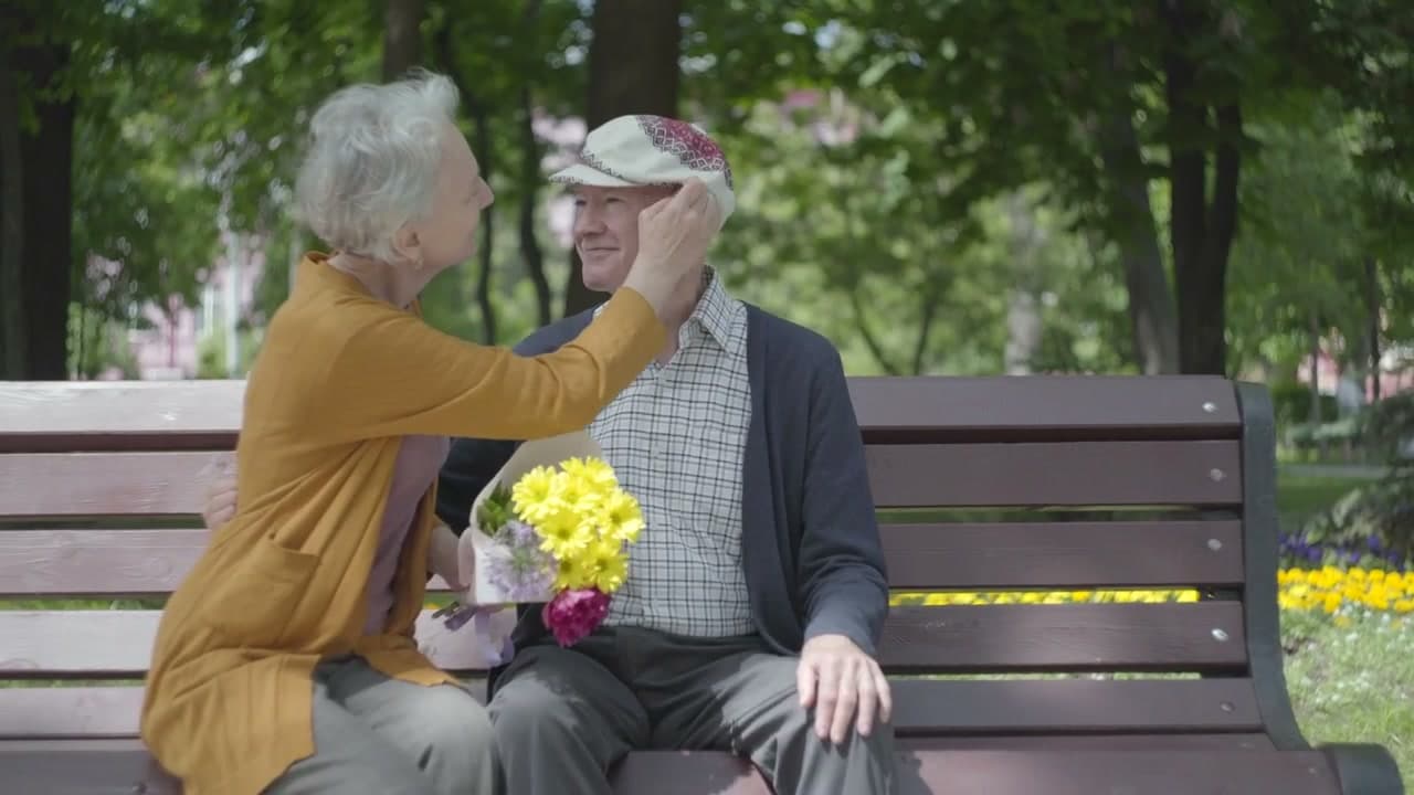 Senior couple receiving supportive home care and therapy guidance